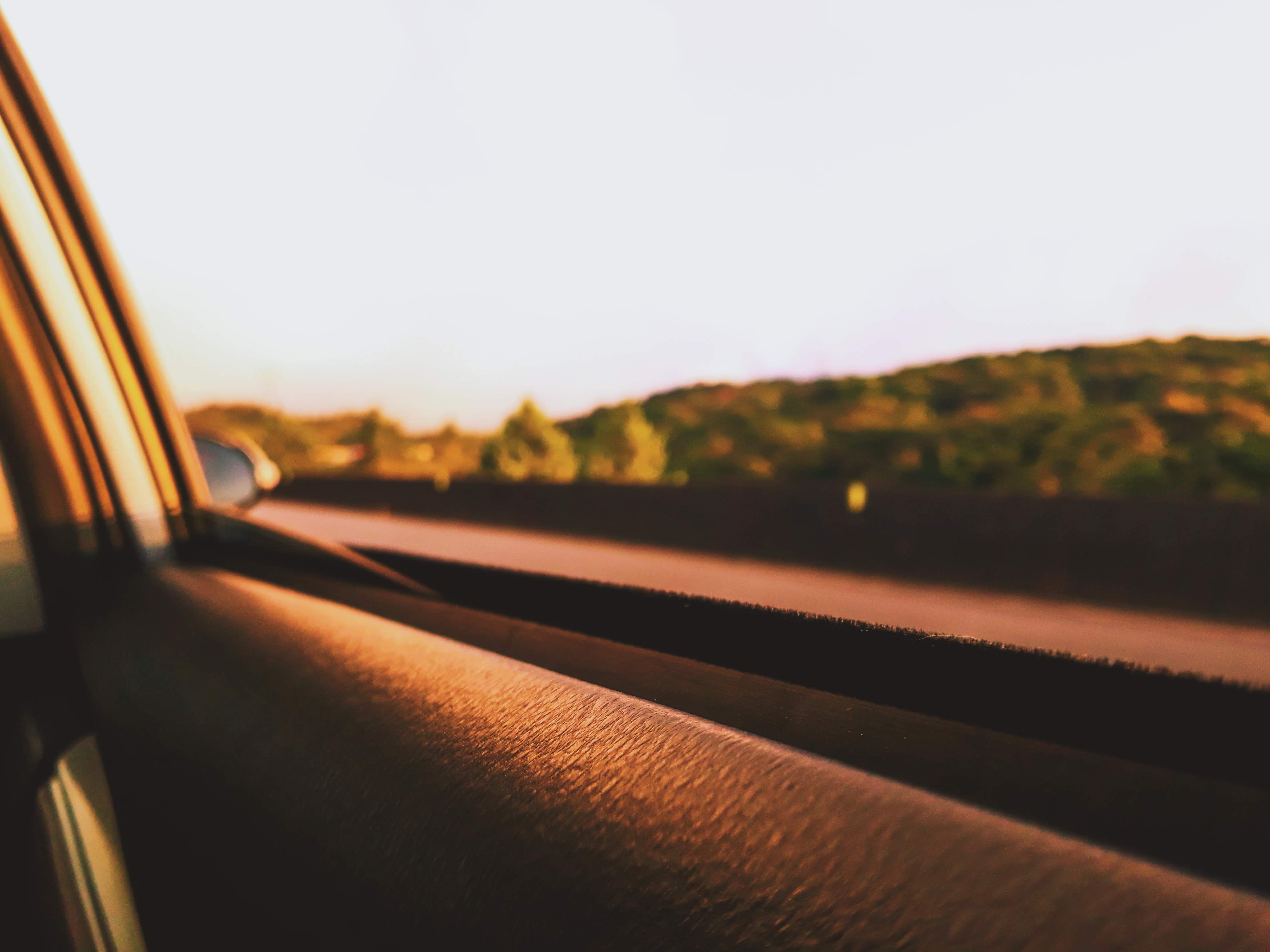 View from a car window on a Nigerian road at golden hour